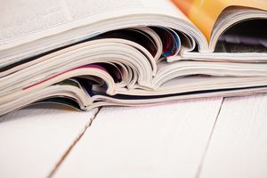 Pile of colorful magazines on a table