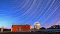 Long shot of the superstructure on the roof under the starry sky, the stars can be recognised as a "line trace" due to the long exposure time