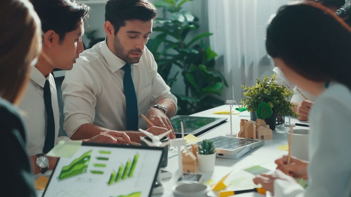 Professional smart business team discuss about using clean energy. Alimentation. environment, nature, green, technology, earth, environmental, growth, eco, conservation, business, power, sustainable, electricity, global, care, aerial view, sustainability, protection, pollution, climate, climate change, innovation, global warming, alternative, recycling, environmental conservation, investment, strategy, industry, development, management, working, futuristic, corporate, entrepreneur, future, economy, teamwork, clean, renewable energy, social issues, top view, engineer, engineering, professional, technician, manufacturing, occupation, smart