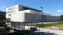 Wide shot of the building, still without plants around it...