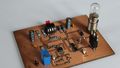 Circuit board with various switching elements and a light bulb