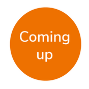Banner "Coming up" Orangefarbener Kreis in welchem in weißer Schrift "Coming up" steht